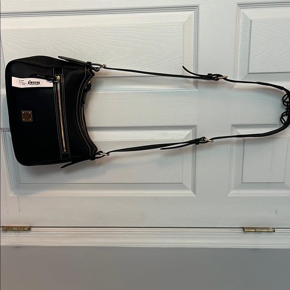 Dooney and Bourke black leather Crossbody bag new with tags never used